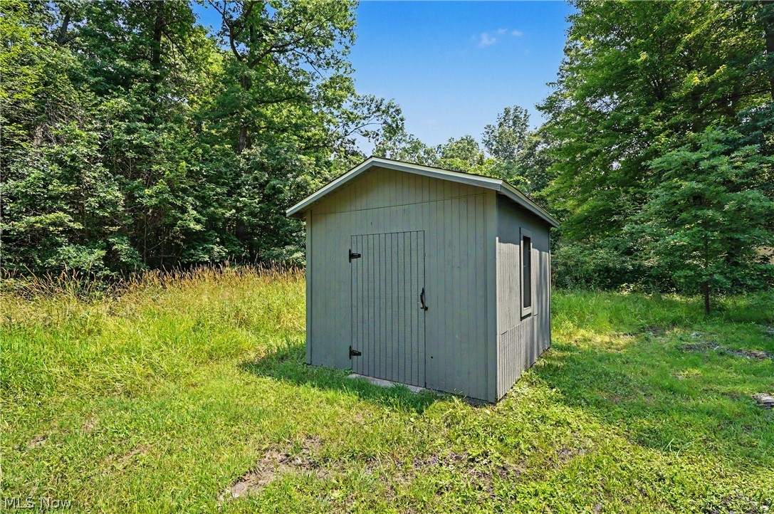 7583 Yale Road Atwater, OH 44201 - Photo 37 of 41 Outbuilding was updated in 2026: paint, roof, new hardware, and some new wood.
