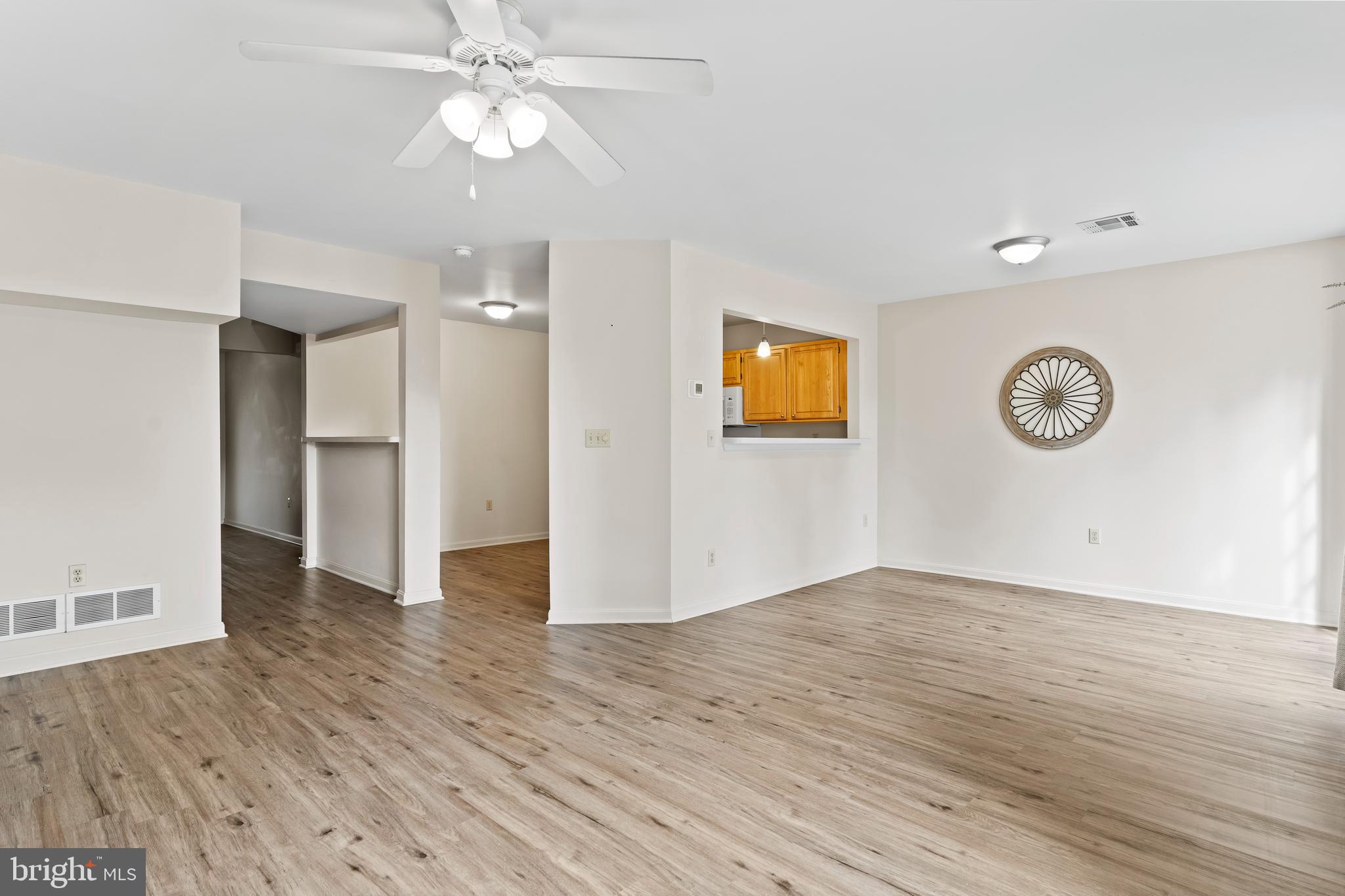149 Cardinal Lane Hummelstown, PA 17036 - Photo 11 of 28 an empty room with wooden floor and a ceiling fan