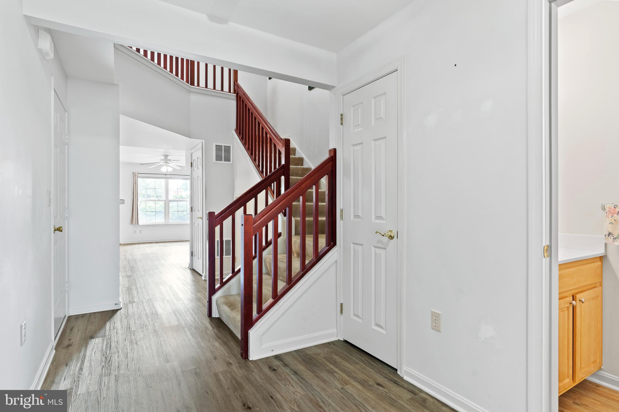 149 Cardinal Lane Hummelstown, PA 17036 - Photo 12 of 28 a view of a hallway with wooden floor and staircase