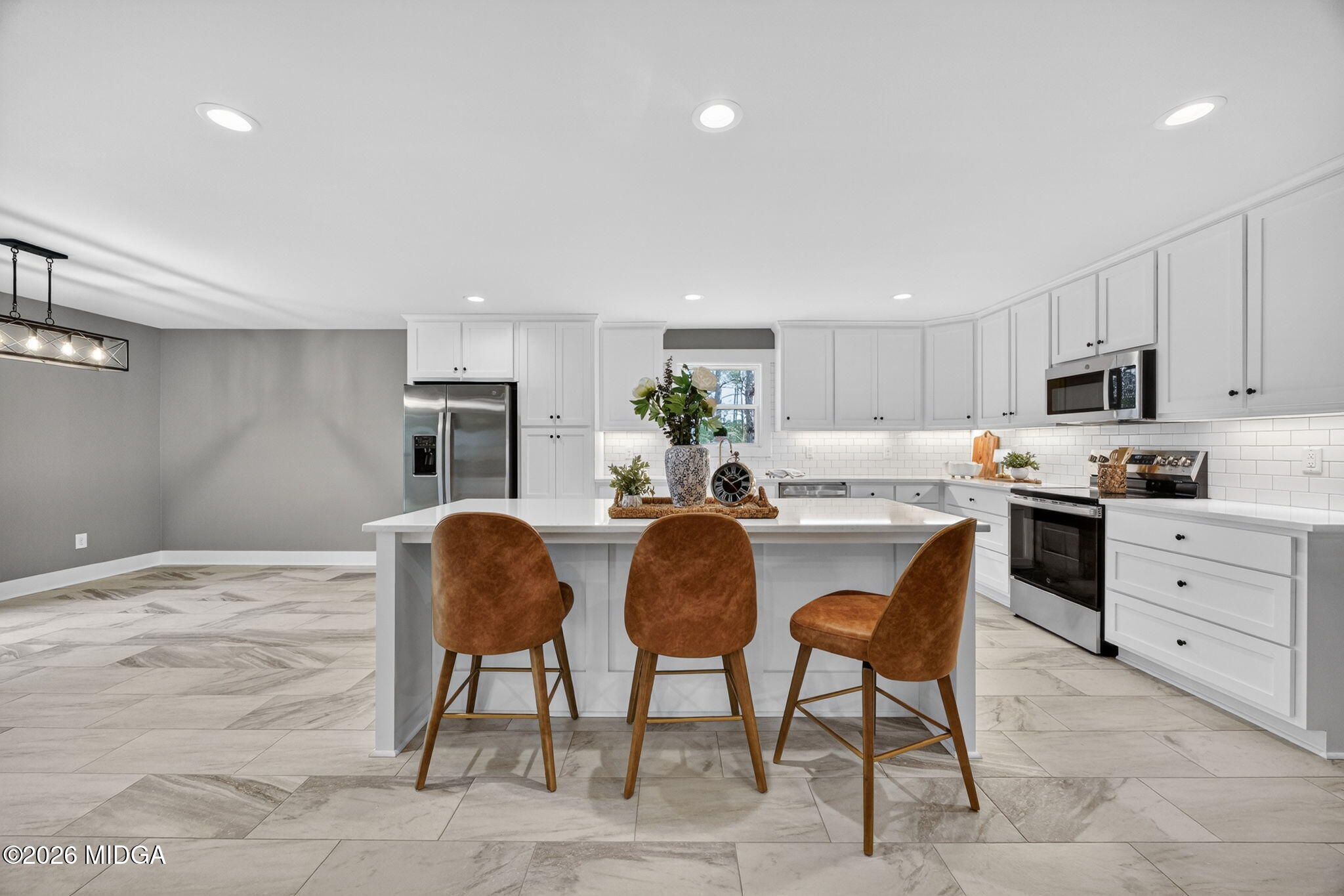 137 Buck Road Gray, GA 31032 - Photo 11 of 35 a kitchen with granite countertop a sink cabinets and stainless steel appliances