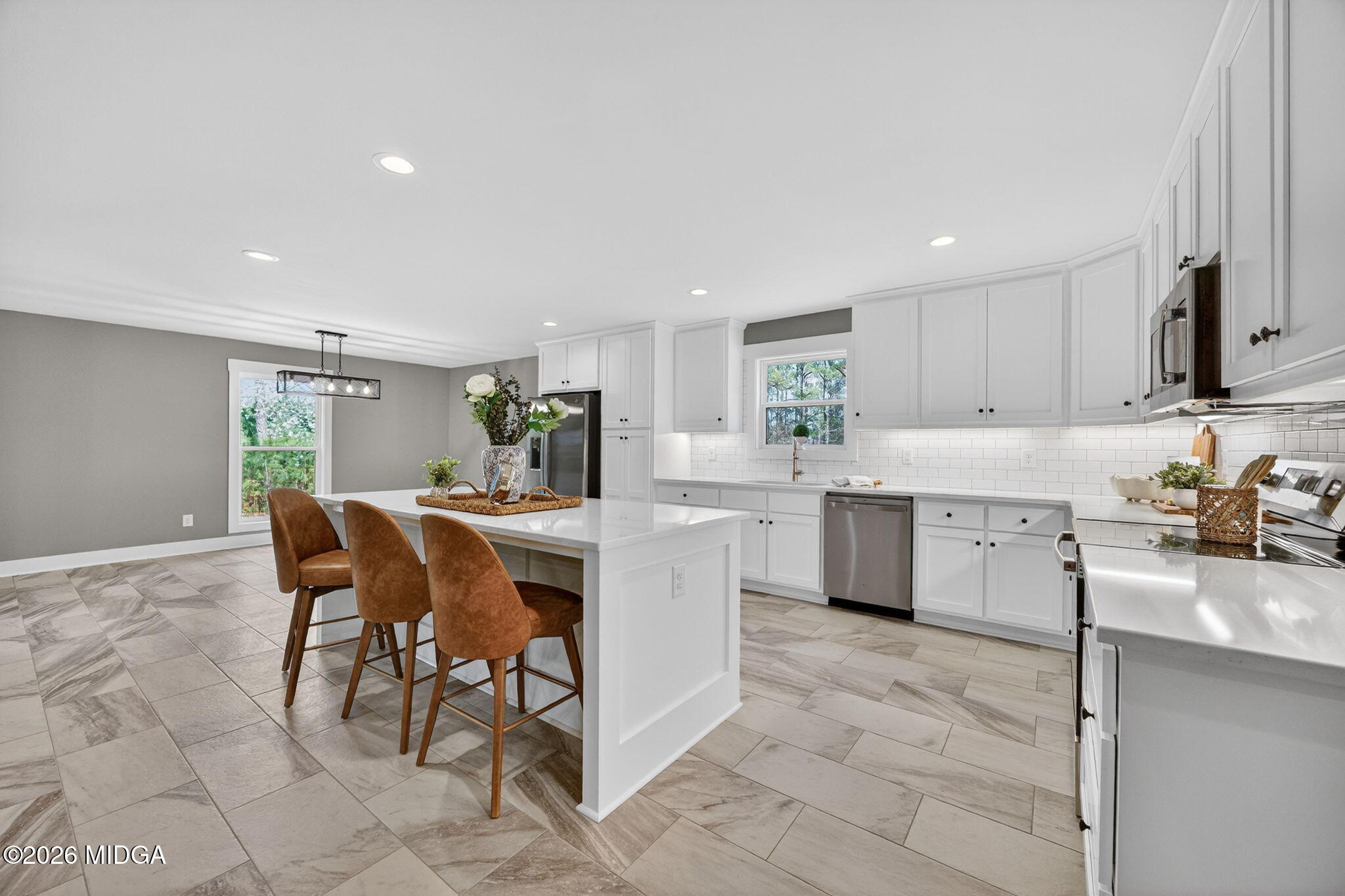 137 Buck Road Gray, GA 31032 - Photo 12 of 35 a kitchen with a sink a counter top space and appliances