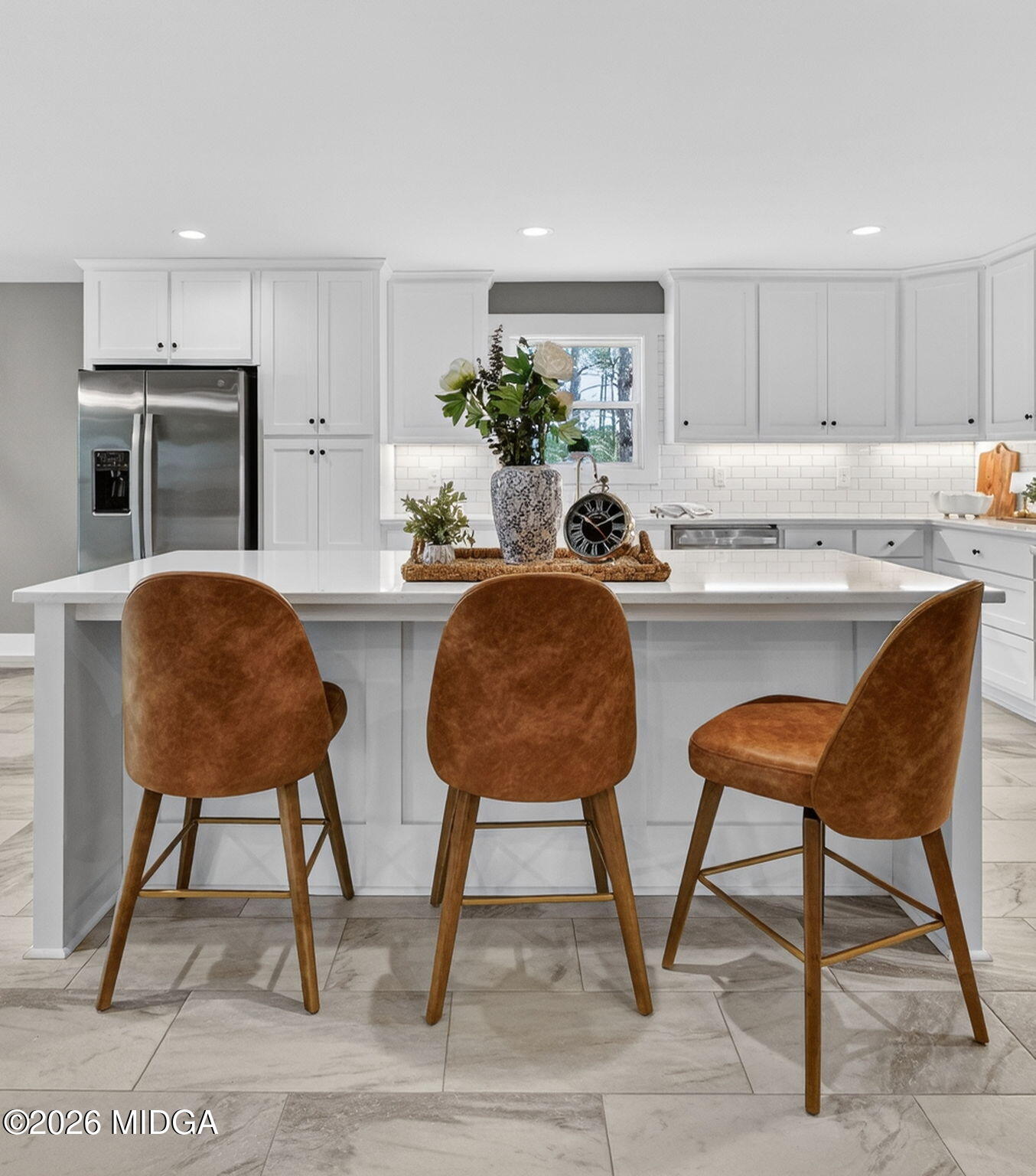 137 Buck Road Gray, GA 31032 - Photo 13 of 35 a kitchen with stainless steel appliances kitchen island granite countertop a table chair and a refrigerator