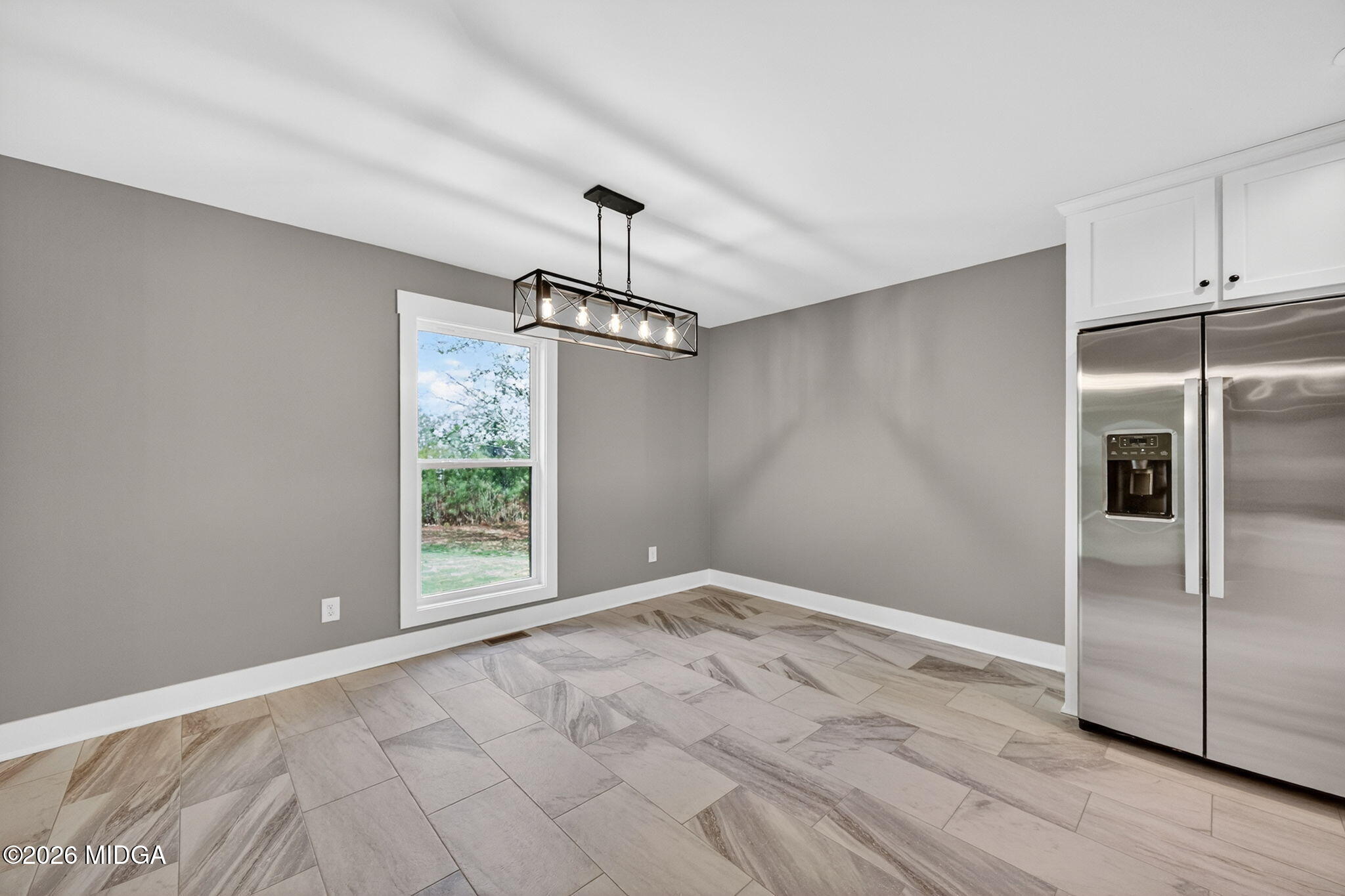 137 Buck Road Gray, GA 31032 - Photo 16 of 35 a view of a kitchen with wooden floor electronic appliances and windows