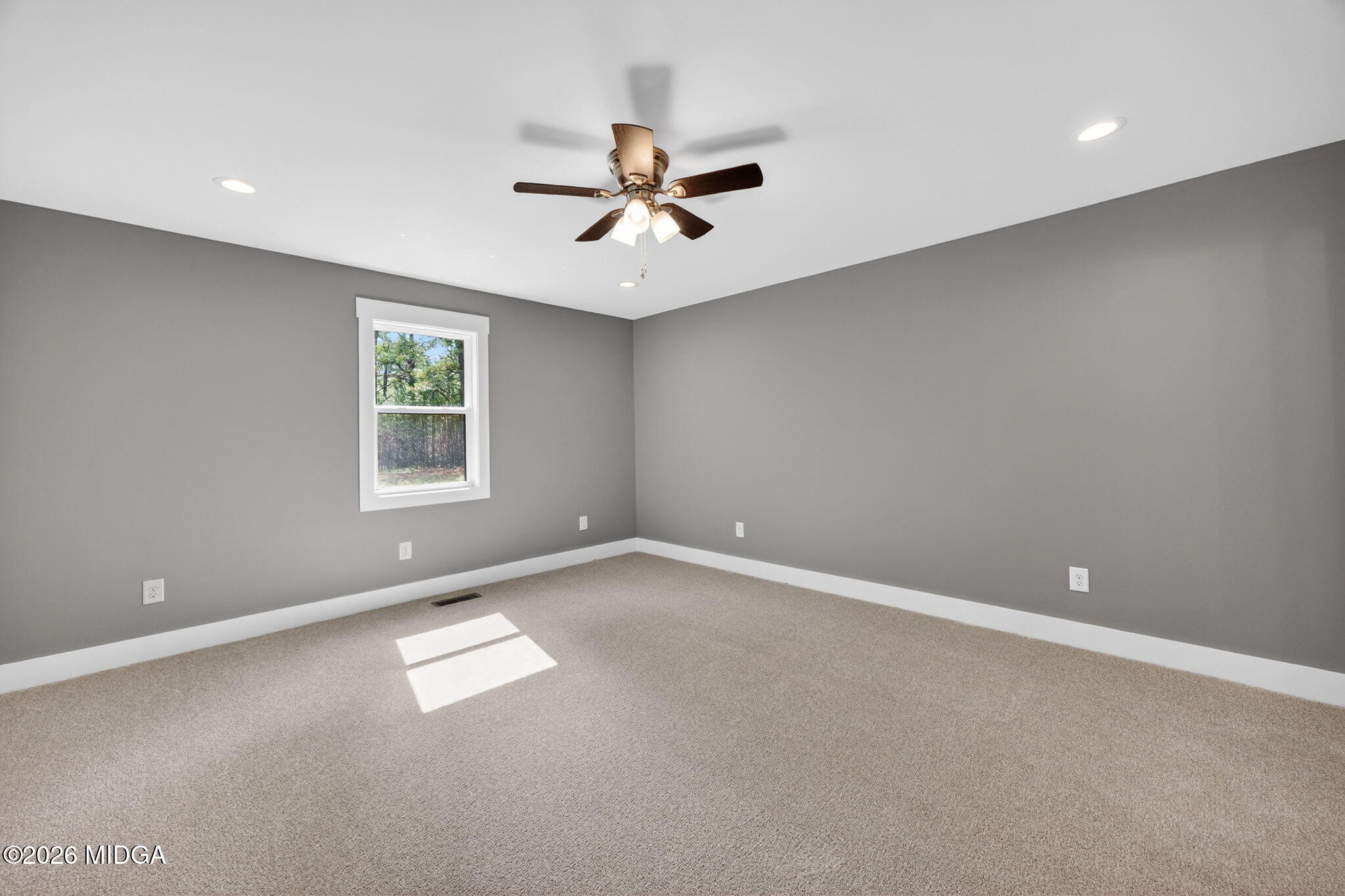 137 Buck Road Gray, GA 31032 - Photo 18 of 35 an empty room with windows and fan