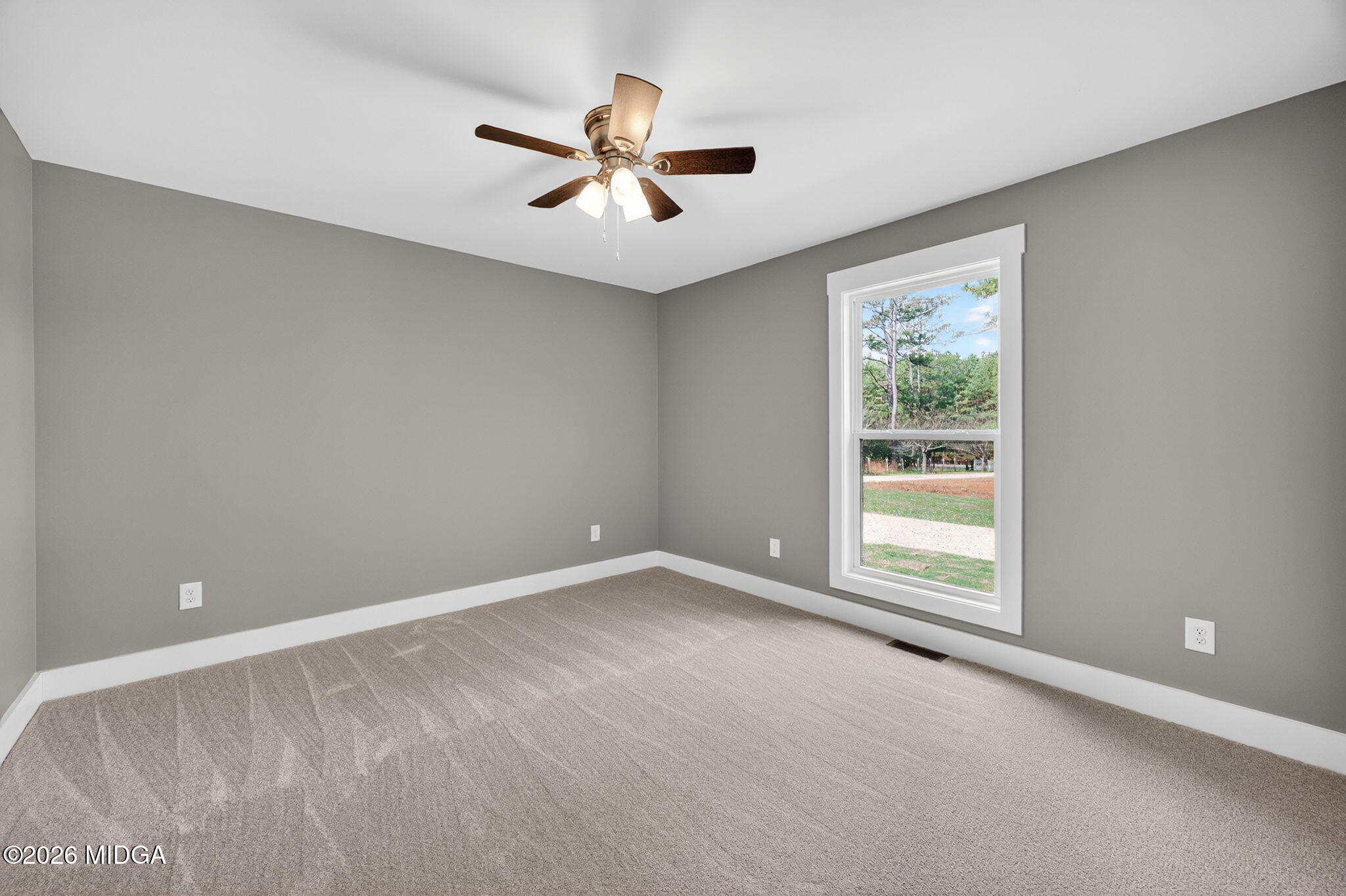 137 Buck Road Gray, GA 31032 - Photo 21 of 35 a view of an empty room with a window