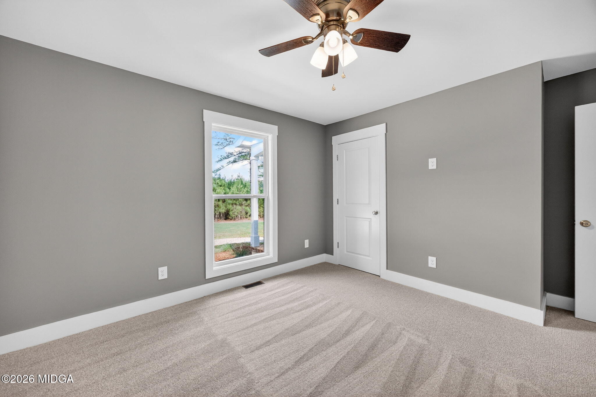 137 Buck Road Gray, GA 31032 - Photo 22 of 35 an empty room with windows and fan