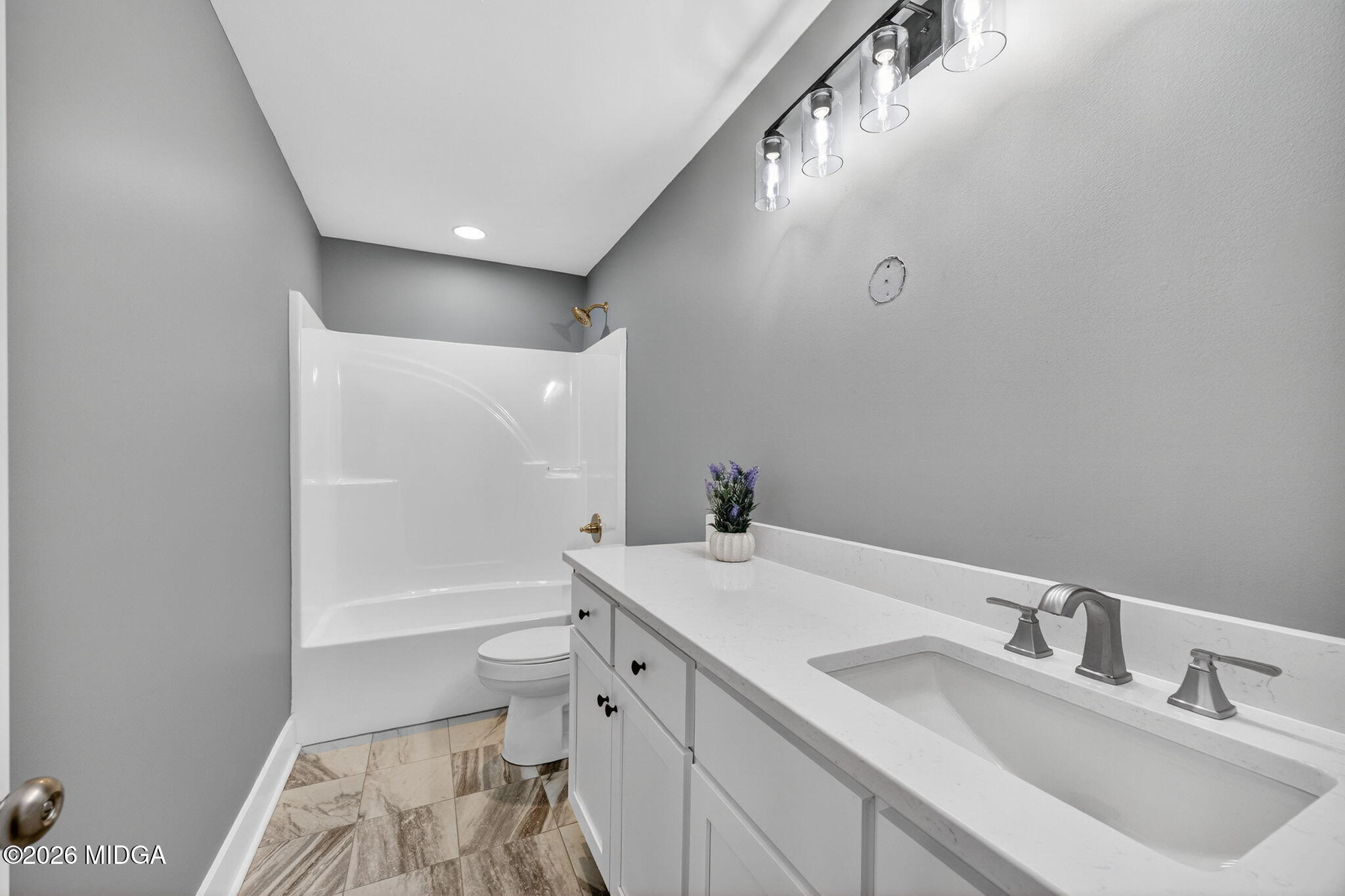 137 Buck Road Gray, GA 31032 - Photo 23 of 35 a bathroom with a sink a toilet and a bathtub