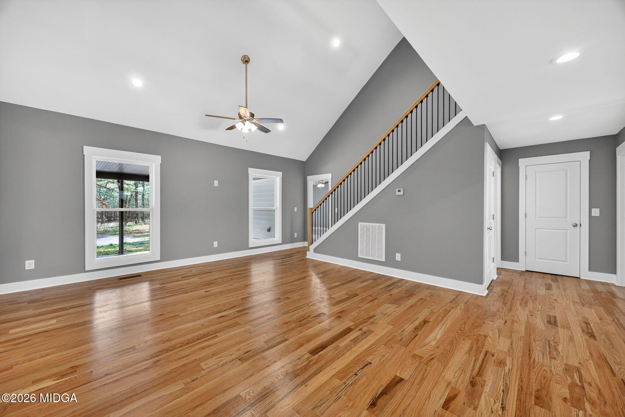 137 Buck Road Gray, GA 31032 - Photo 9 of 35 a view of an empty room with wooden floor and a window