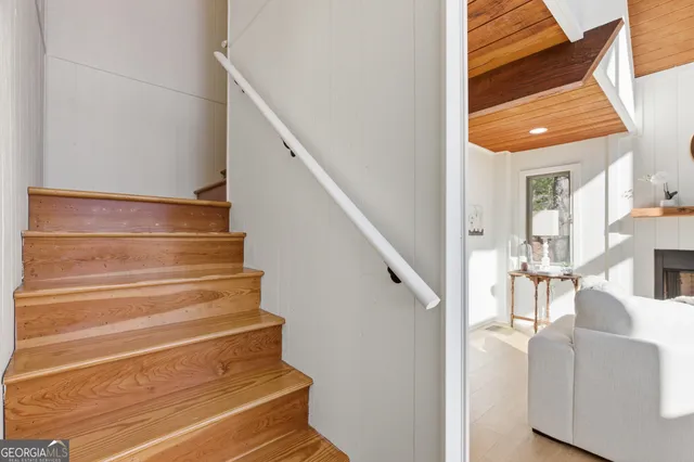 a view of entryway and hall with wooden floor