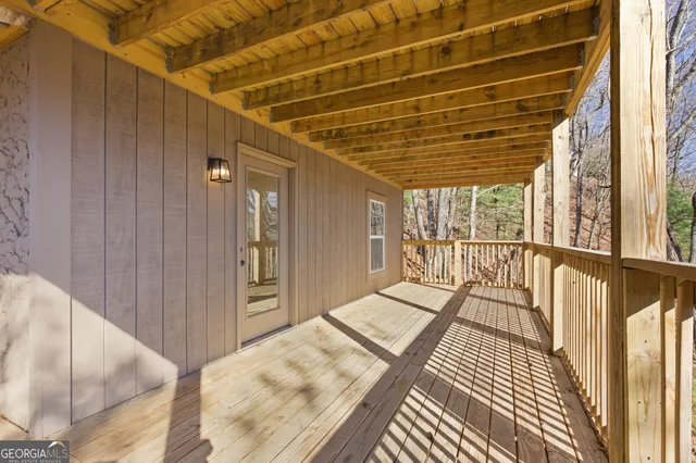 a view of balcony with wooden floor