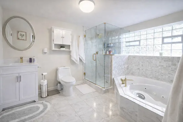 a bathroom with a toilet a sink and a bathtub