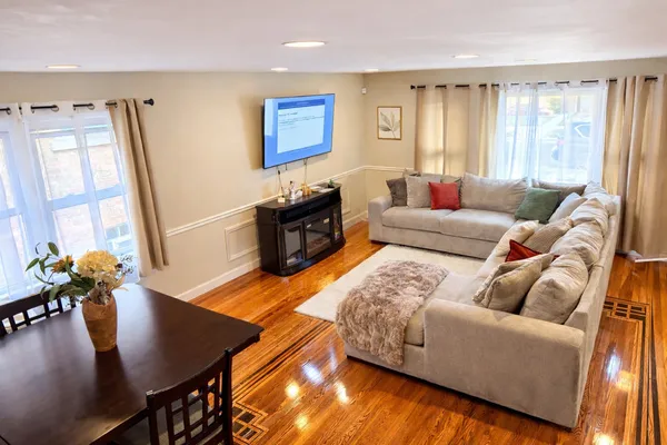 a living room with furniture and a flat screen tv