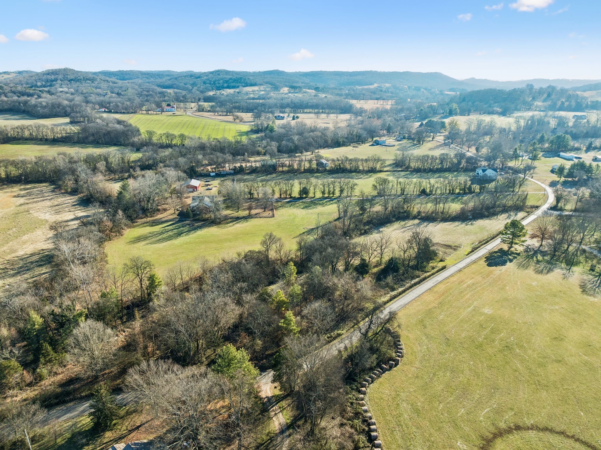 0 Buck Matthews Road Culleoka, TN 38451 - Photo 46 of 69 an aerial view of residential houses with outdoor space and river