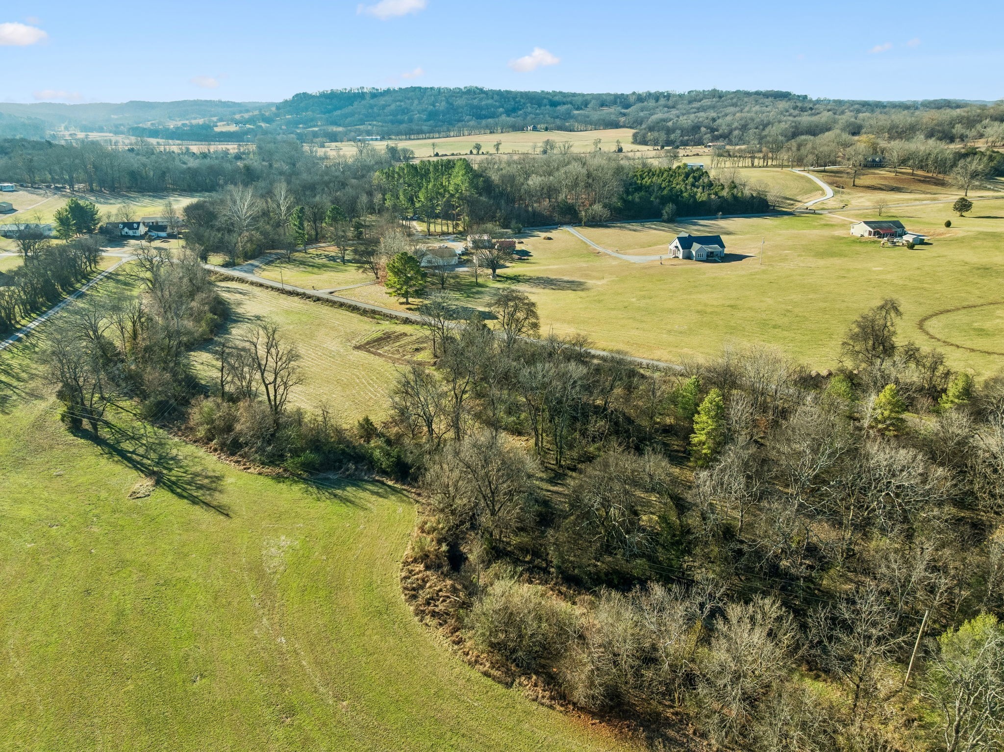 0 Buck Matthews Road Culleoka, TN 38451 - Photo 51 of 69 a view of a lake with houses in the back