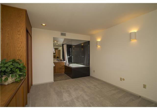 4920 Rancho Grande Del Mar, CA 92014 - Photo 24 of 25 This bedroom has a large dressing room off the private bath with steps down which lead to a larger open sleep area. A great second master bedroom suit if desired.