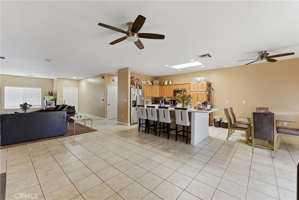 11368 Cactus Avenue Bloomington, CA 92316 - Photo 16 of 32 a living room with lots of furniture and white walls