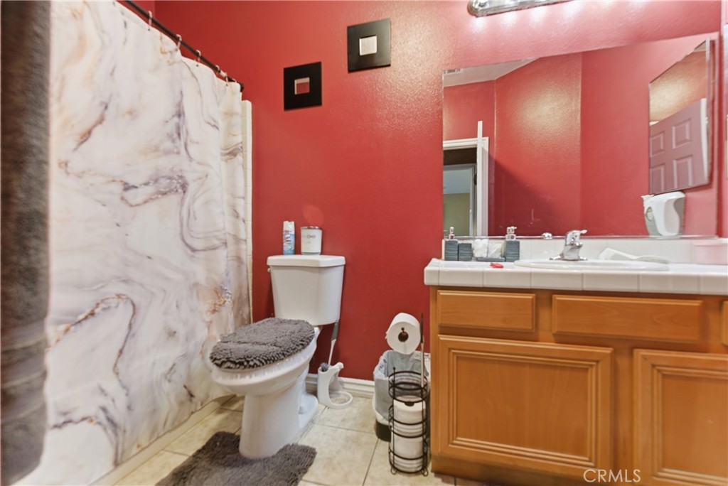 11368 Cactus Avenue Bloomington, CA 92316 - Photo 23 of 32 a bathroom with a sink and a toilet