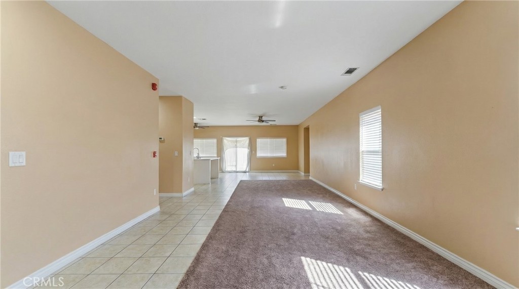 11368 Cactus Avenue Bloomington, CA 92316 - Photo 5 of 32 a view of a big room with windows and chandelier