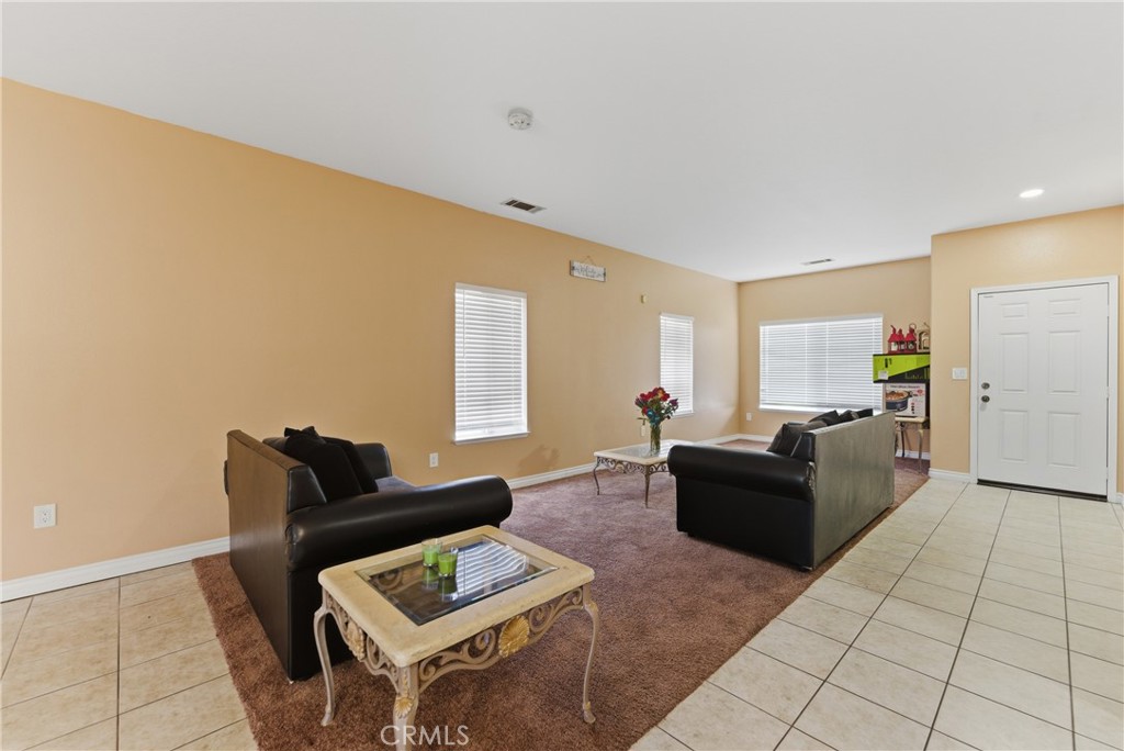 11368 Cactus Avenue Bloomington, CA 92316 - Photo 6 of 32 a living room with furniture and a couch