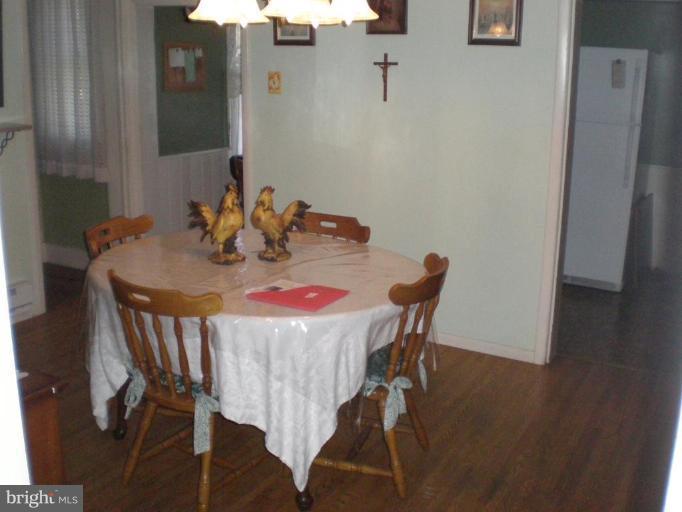 18152 Spring Run Road Dry Run, PA 17220 - Photo 27 of 29 a view of a dining room with furniture and wooden floor