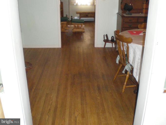 18152 Spring Run Road Dry Run, PA 17220 - Photo 28 of 29 a view of a room with wooden floor and a sink