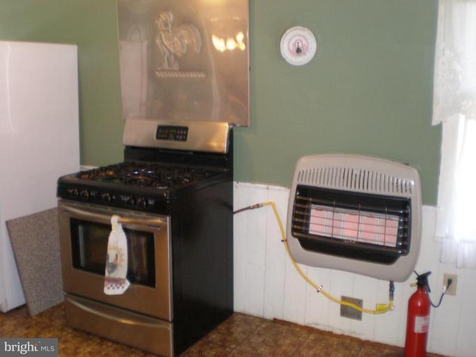 18152 Spring Run Road Dry Run, PA 17220 - Photo 4 of 29 a kitchen with a stove and a microwave
