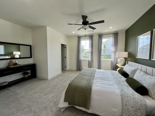 a bedroom with bed and window