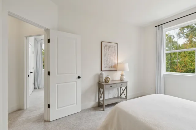 a kitchen with stainless steel appliances granite countertop a sink a stove a refrigerator and a microwave