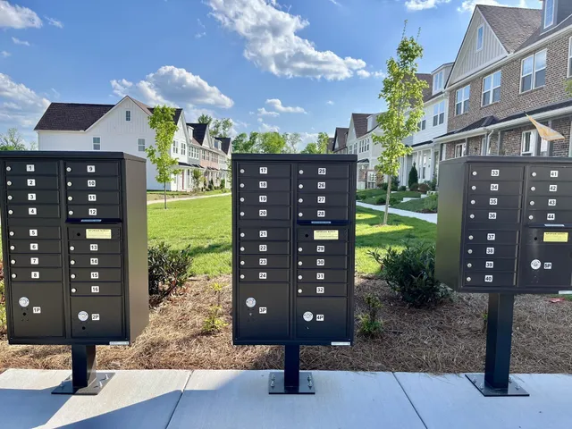 a kitchen with stainless steel appliances granite countertop a stove a sink dishwasher a refrigerator and cabinets with wooden floor