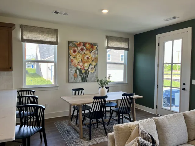 a view of a dining room with furniture