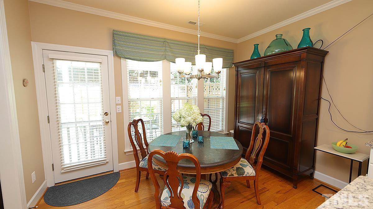 3621 Lion Ridge Court Raleigh, NC 27612 - Photo 15 of 34 a view of a dining room with furniture window and outside view