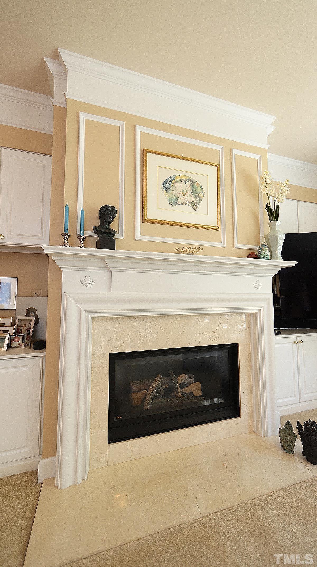3621 Lion Ridge Court Raleigh, NC 27612 - Photo 17 of 34 a living room with furniture a fireplace and flat screen tv