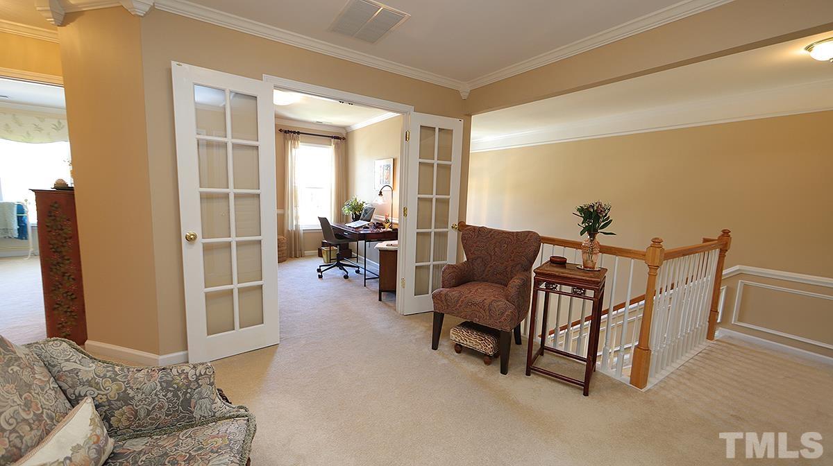 3621 Lion Ridge Court Raleigh, NC 27612 - Photo 28 of 34 a living room with furniture and a window