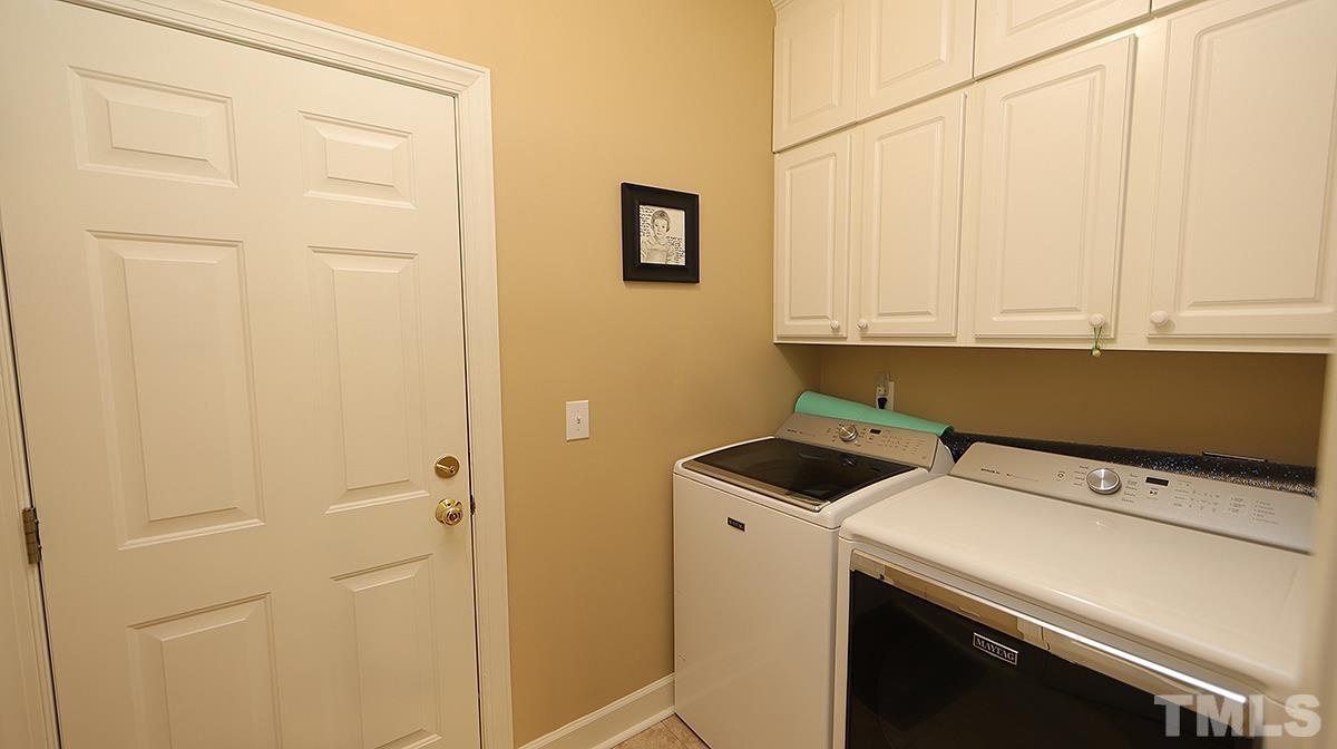 3621 Lion Ridge Court Raleigh, NC 27612 - Photo 33 of 34 a utility room with dryer and washer