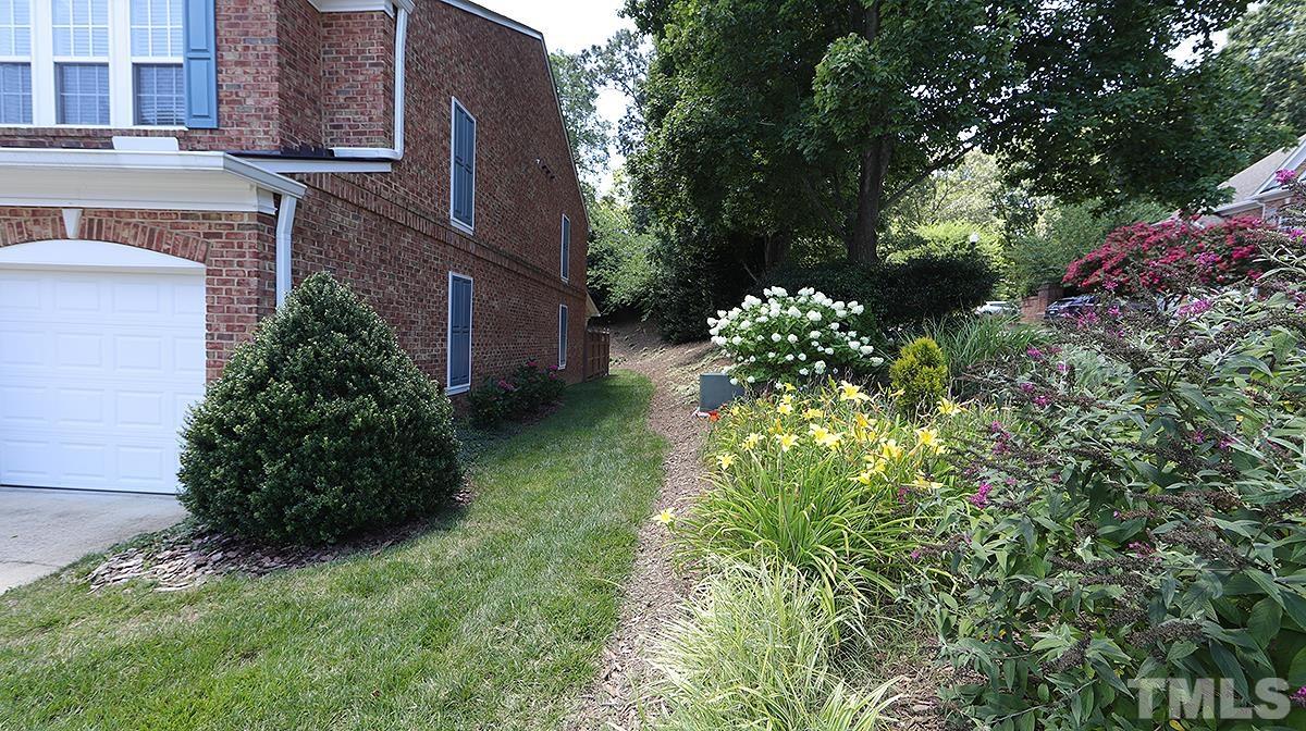 3621 Lion Ridge Court Raleigh, NC 27612 - Photo 5 of 34 a plant is in front of a building