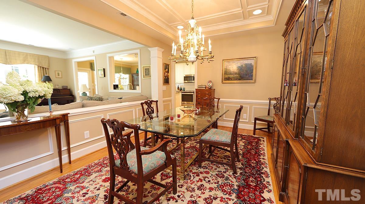 3621 Lion Ridge Court Raleigh, NC 27612 - Photo 8 of 34 a view of a dining room with furniture and chandelier