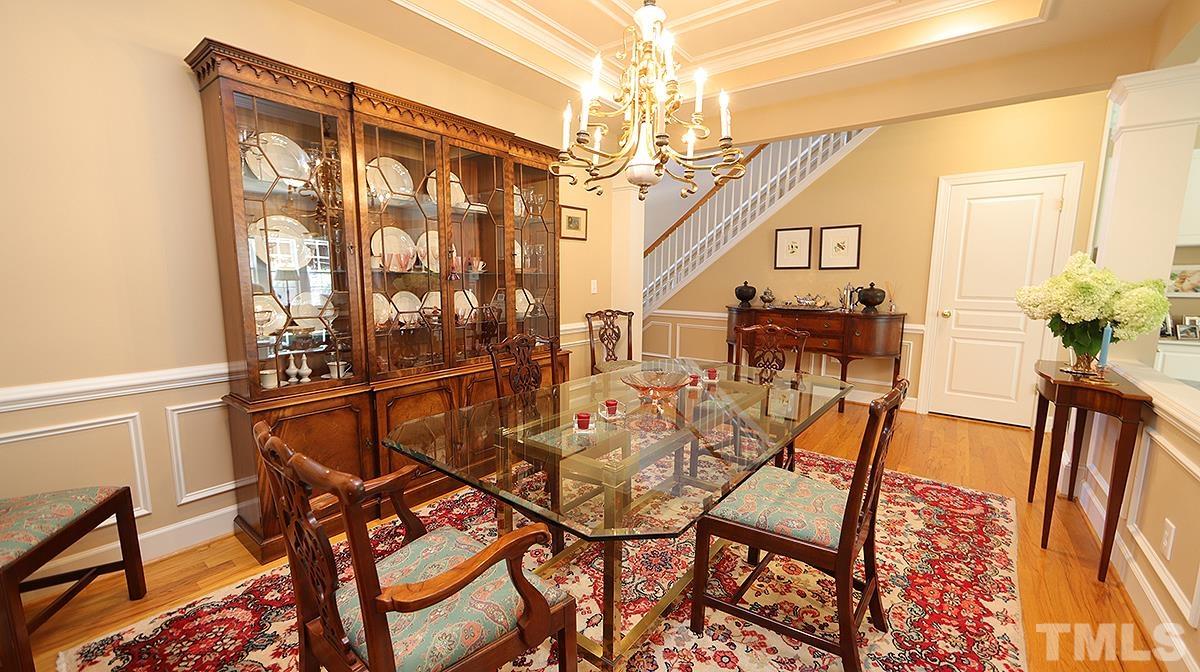 3621 Lion Ridge Court Raleigh, NC 27612 - Photo 9 of 34 a view of a dining room with furniture and a chandelier