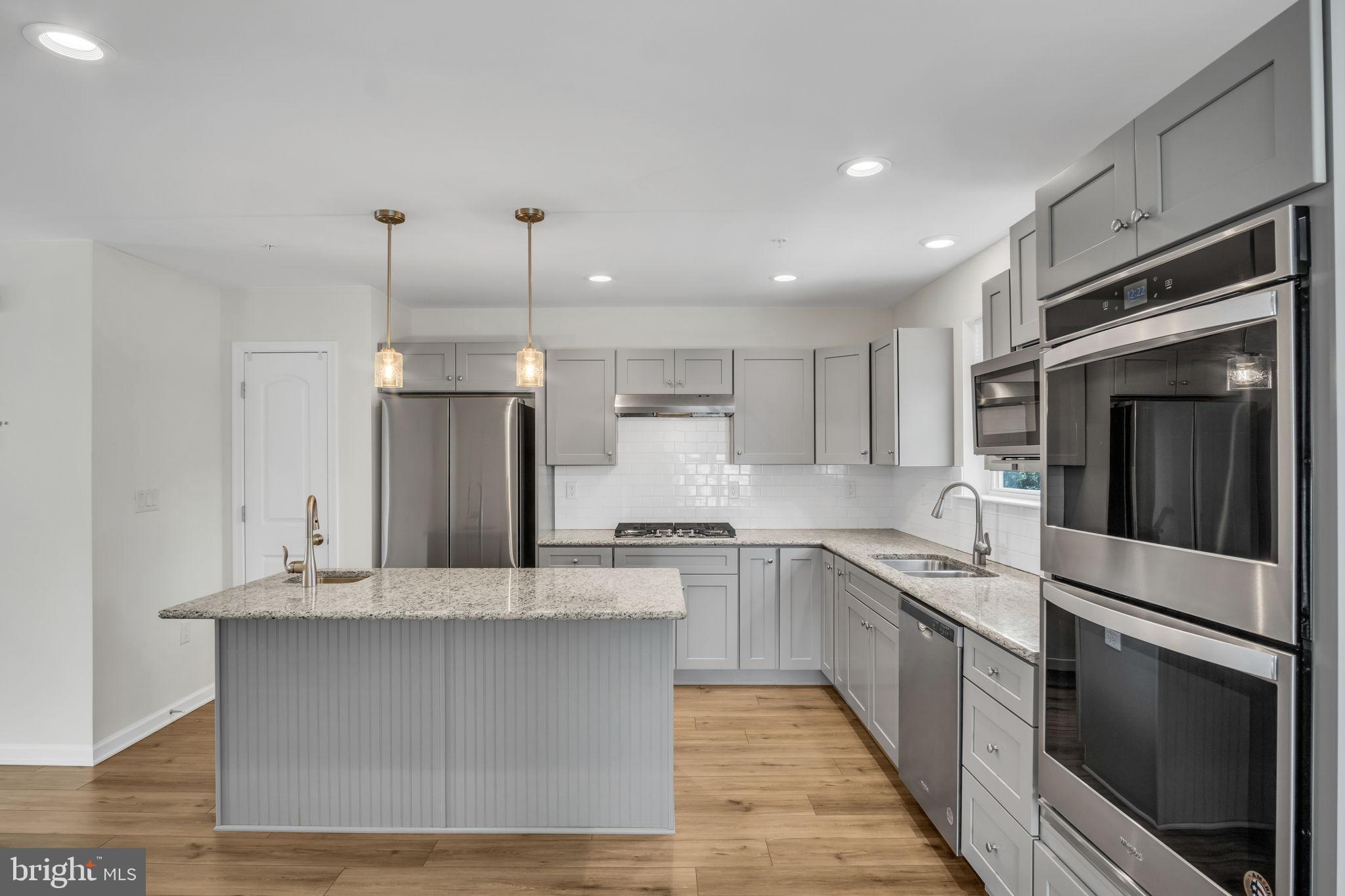 127 High Pointe Drive, Unit 31 Hummelstown, PA 17036 - Photo 14 of 28 Modern kitchen with sleek finishes.