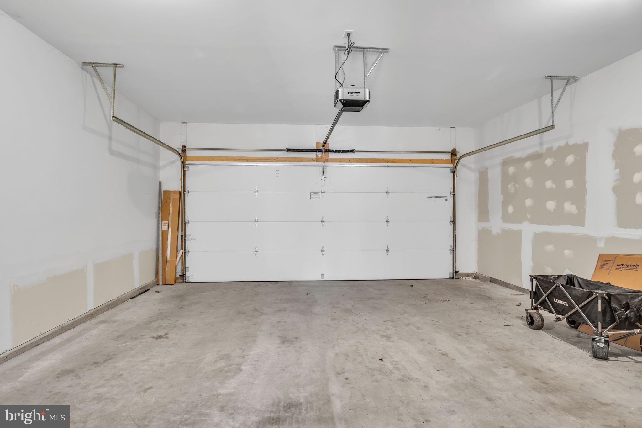 127 High Pointe Drive, Unit 31 Hummelstown, PA 17036 - Photo 26 of 28 Spacious garage with ample potential.