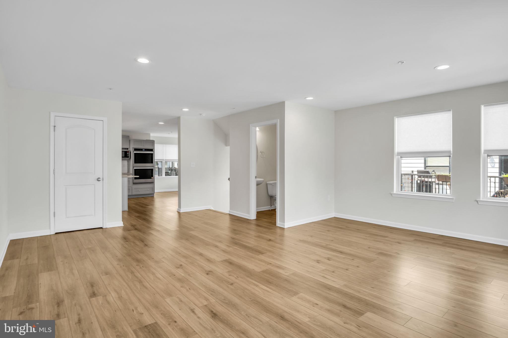 127 High Pointe Drive, Unit 31 Hummelstown, PA 17036 - Photo 7 of 28 Spacious, light-filled modern living area.