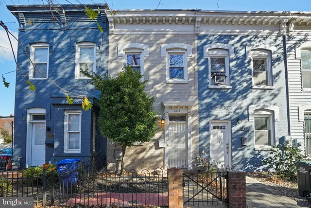 a front view of a building with street view