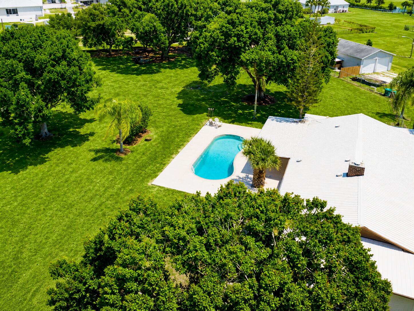 3856 Southwest 11th Avenue Okeechobee, FL 34974 - Photo 2 of 42 Aerial Looking at Back Yard