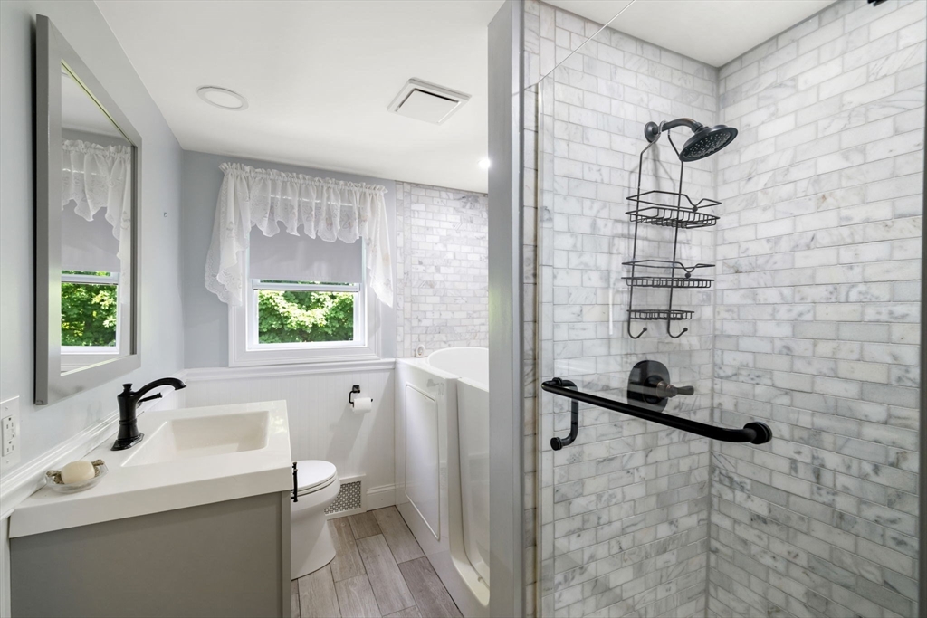 40 Bell Road Weymouth, MA 02188 - Photo 40 of 41 a bathroom with a sink a toilet and a shower