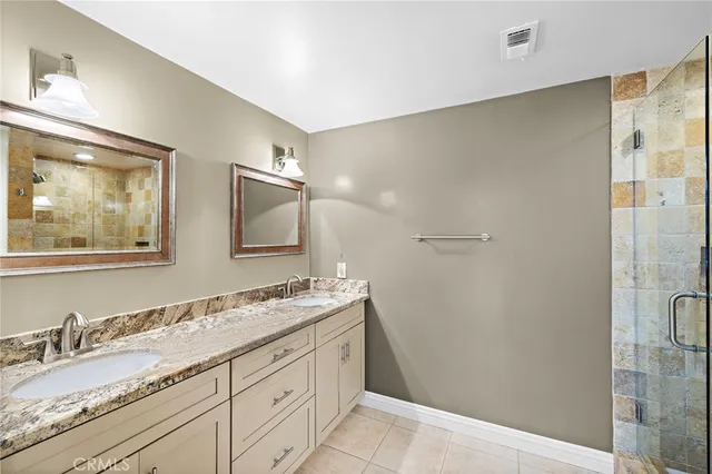 a bathroom with a shower and a sink