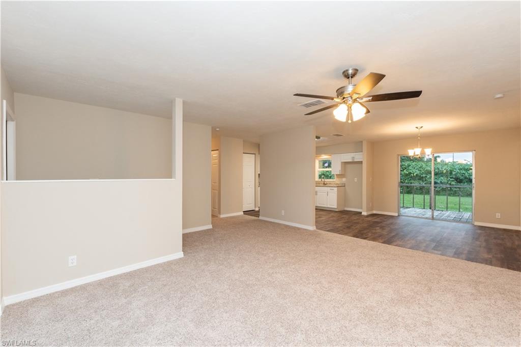 1770 52nd Terrace Southwest Naples, FL 34116 - Photo 11 of 23 a view of a livingroom with a ceiling fan and window