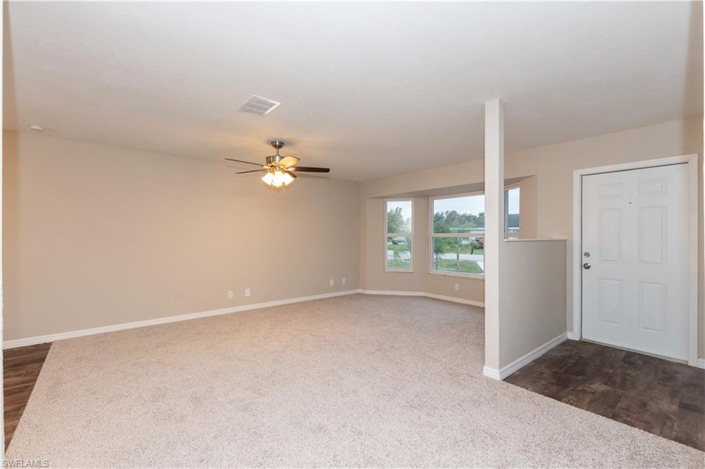 1770 52nd Terrace Southwest Naples, FL 34116 - Photo 13 of 23 an empty room with a ceiling fan and a window