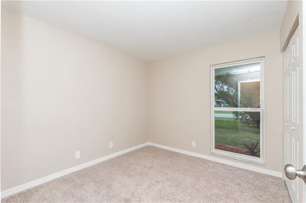 1770 52nd Terrace Southwest Naples, FL 34116 - Photo 15 of 23 an empty room with a window