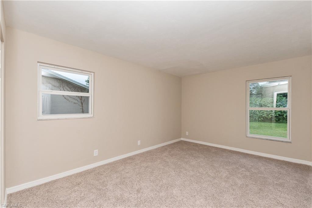 1770 52nd Terrace Southwest Naples, FL 34116 - Photo 16 of 23 an empty room with a window
