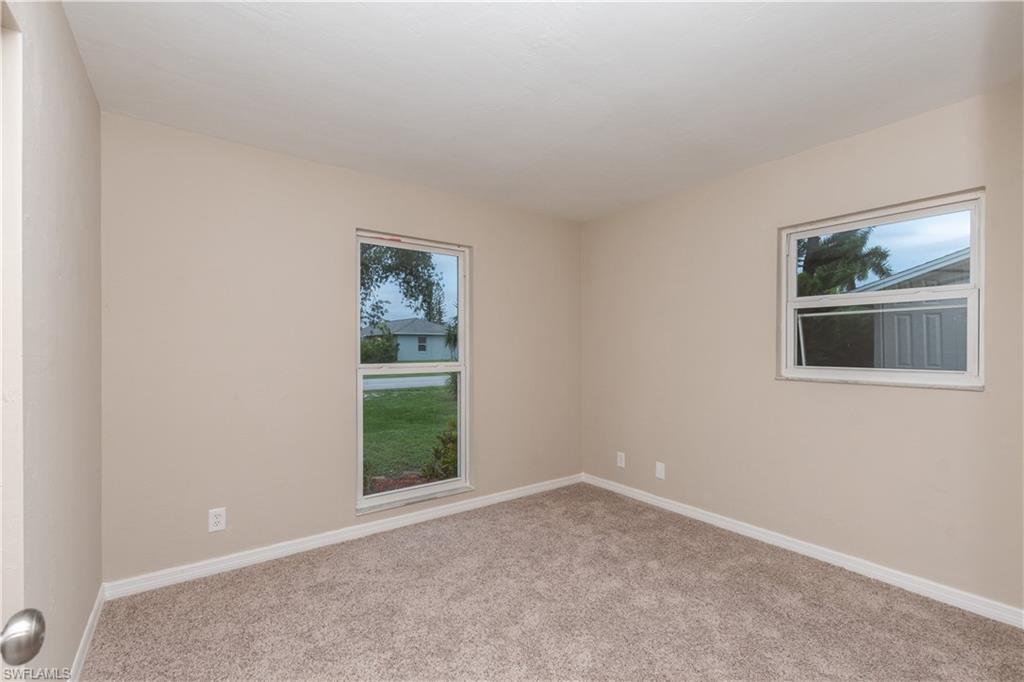 1770 52nd Terrace Southwest Naples, FL 34116 - Photo 18 of 23 a view of an empty room with a window