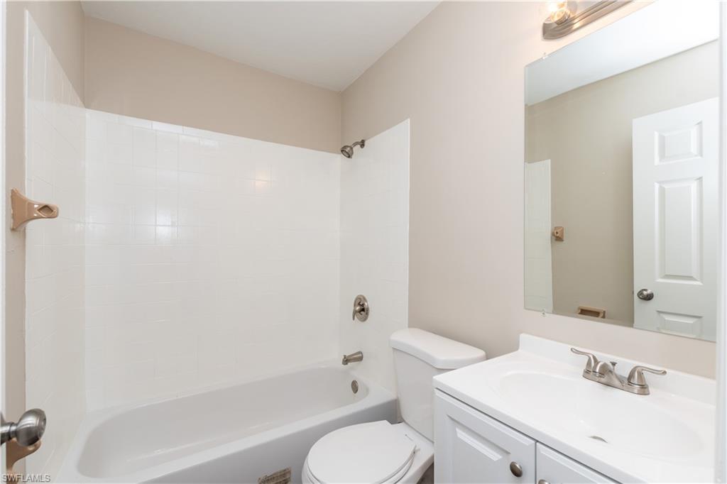 1770 52nd Terrace Southwest Naples, FL 34116 - Photo 21 of 23 a bathroom with a sink toilet and shower
